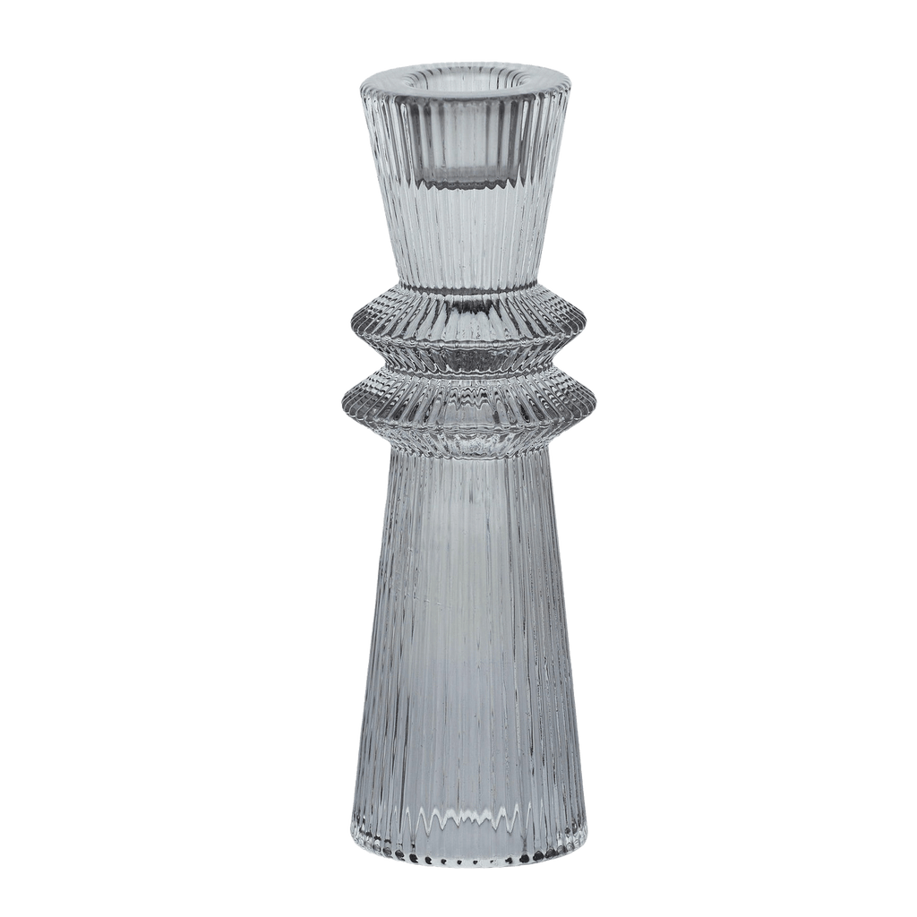 Retro shaped glass candlestick holder with a ridged texture. Light grey in colour. Tapered outwards from top to bottom with 2 concave points in the middle. Holds tapered candles. 5cm diameter x 16cm height. Available from the Side Serve Shop, Perth WA